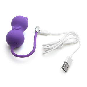 Kitty Kegel Ball Vibrator has a cat shape in the color purple with a long silicone strap connected to a white USB charging cable