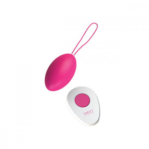 hot pink VeDO Peach Rechargeable Egg Insertable Bullet Vibrator with white remote that has one pink button in the center