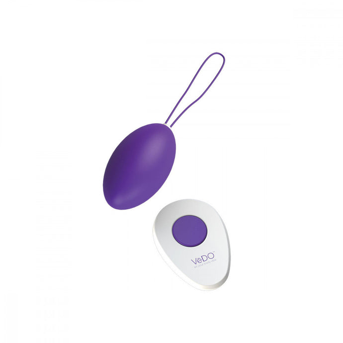 purple VeDO Peach Rechargeable Egg Insertable Bullet Vibrator with white remote that has one purple button in the center