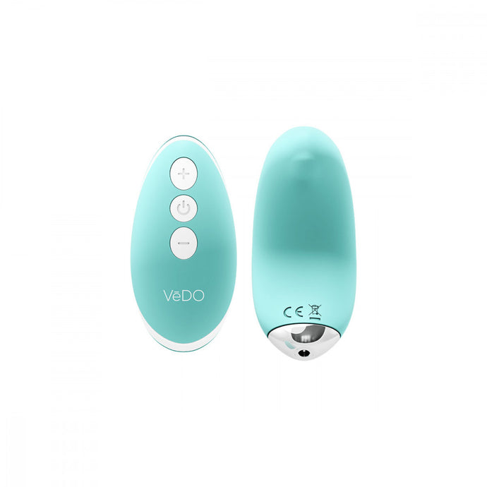 turquoise Vedo Niki Rechargeable Silicone Panty Vibrator and pink remote with silver power, plus, and minus icon buttons.