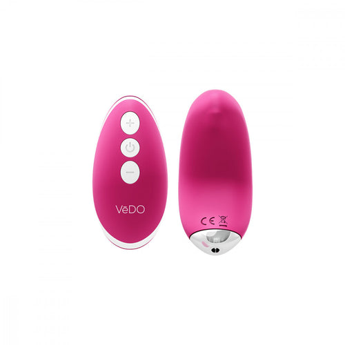 pink Vedo Niki Rechargeable Silicone Panty Vibrator and pink remote with silver power, plus, and minus icon buttons.