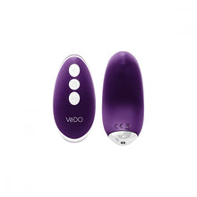 deep purple Vedo Niki Rechargeable Silicone Panty Vibrator and pink remote with silver power, plus, and minus icon buttons.